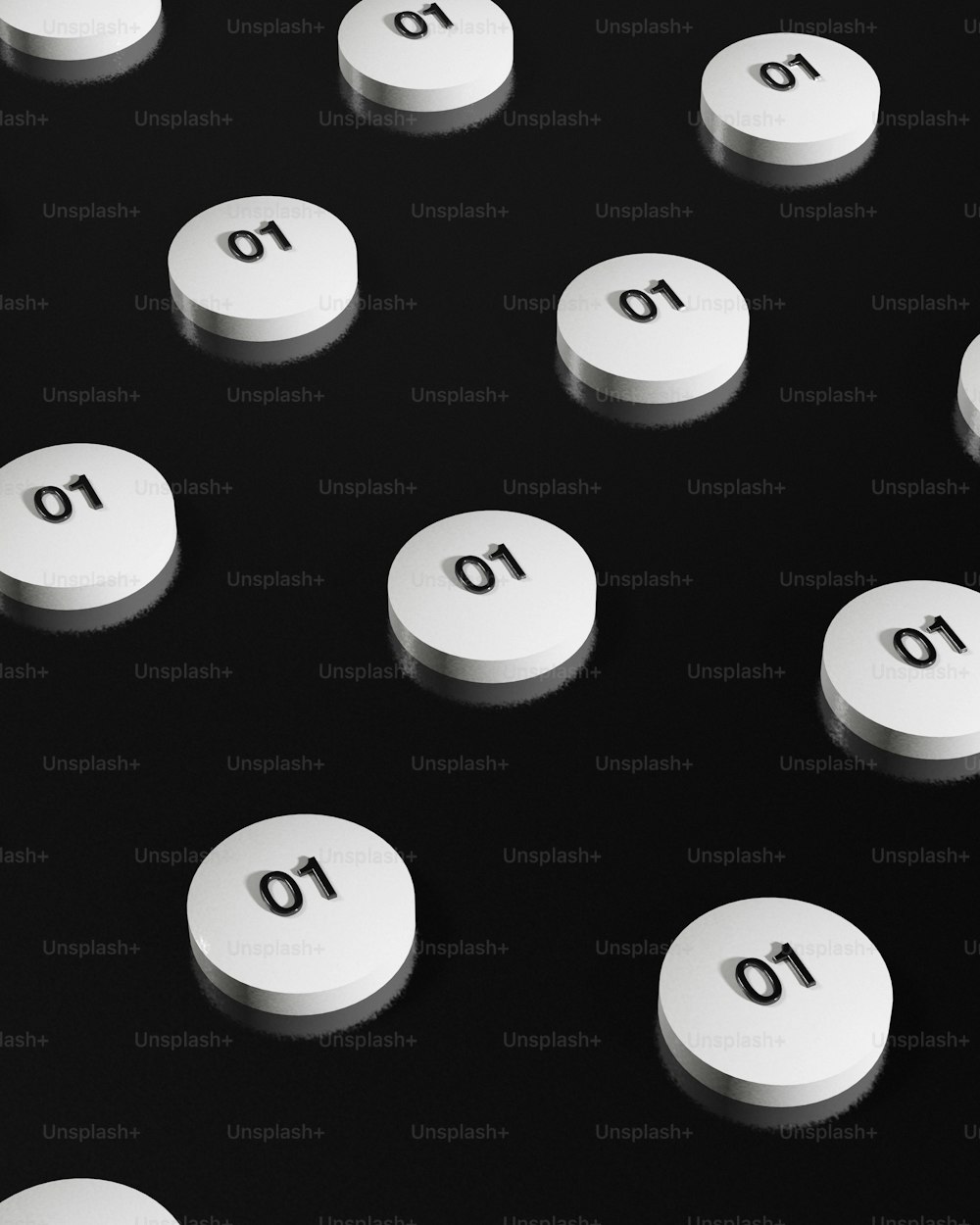 a group of white pills sitting on top of a table