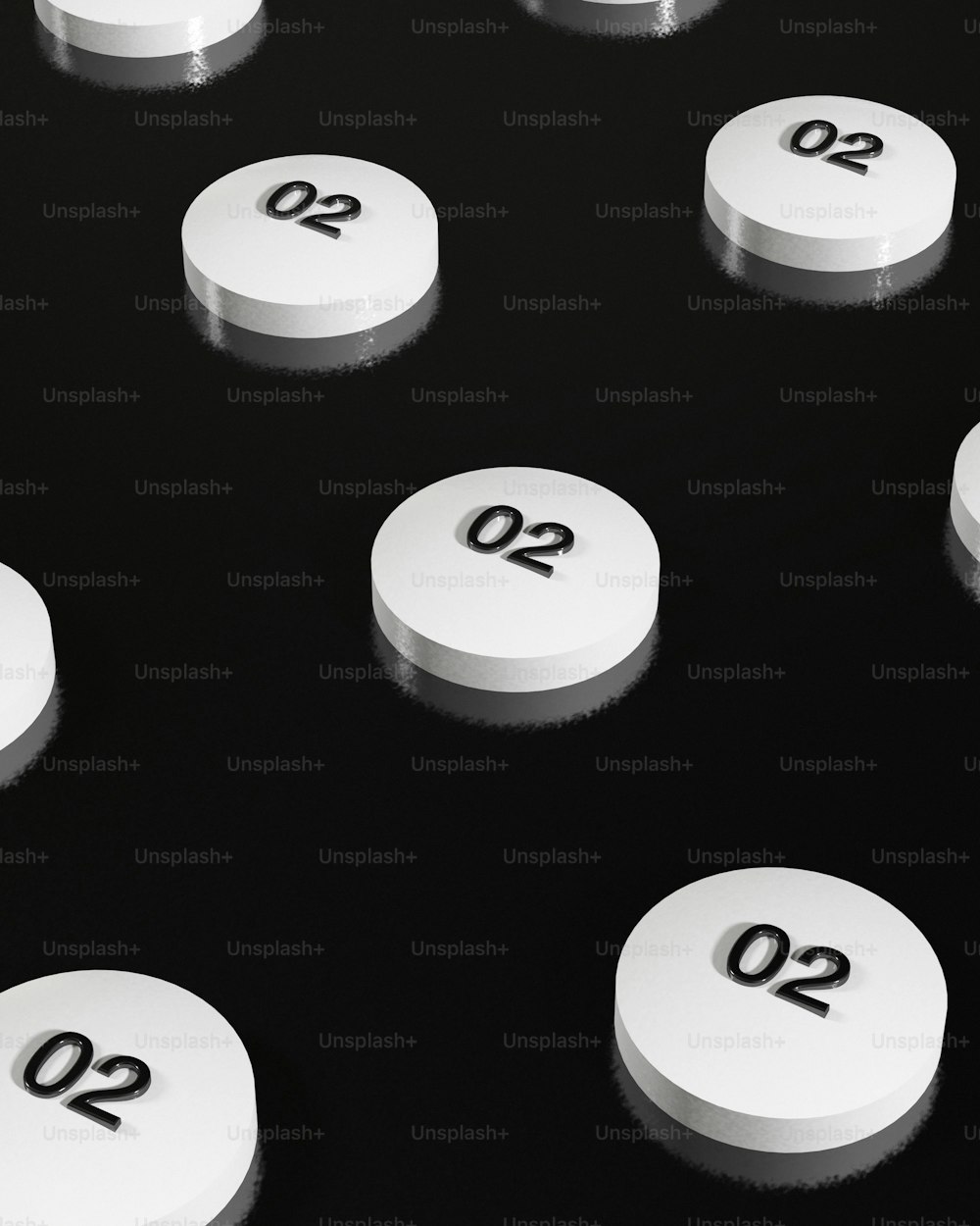 a group of white pills sitting on top of a table