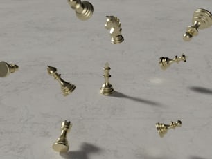 a group of gold chess pieces on a marble surface
