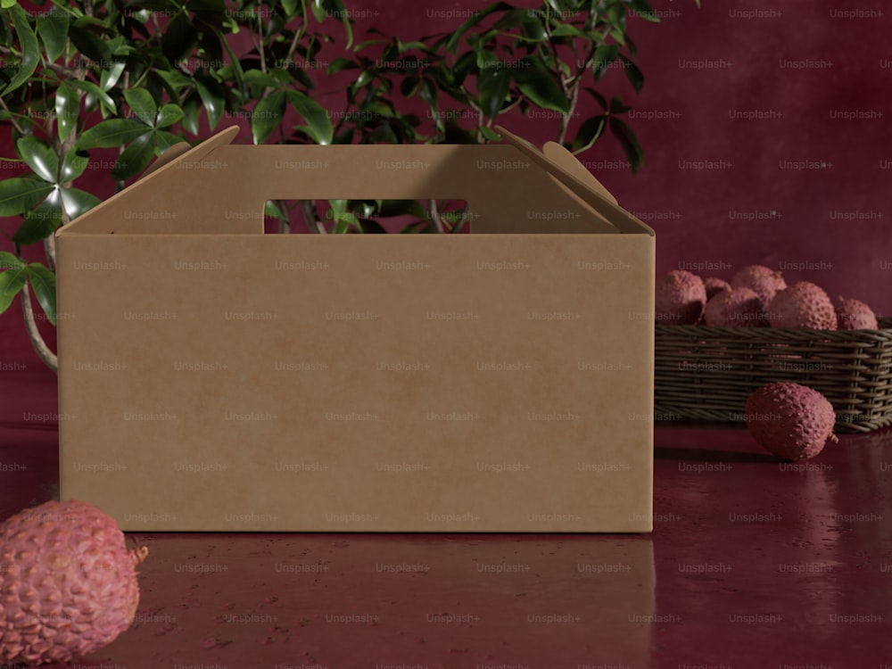 a brown box sitting on top of a table next to a plant