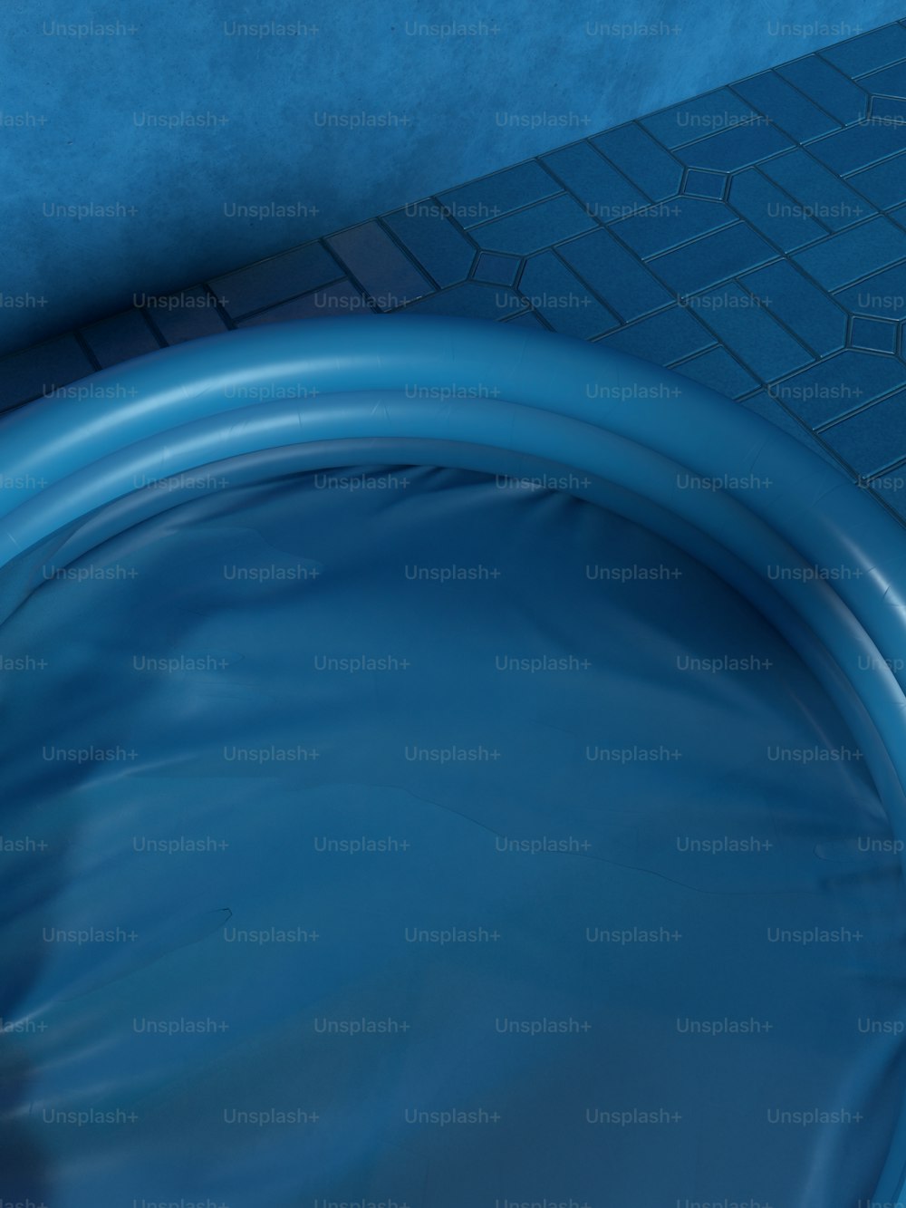 a close up of a blue hose on a tiled floor