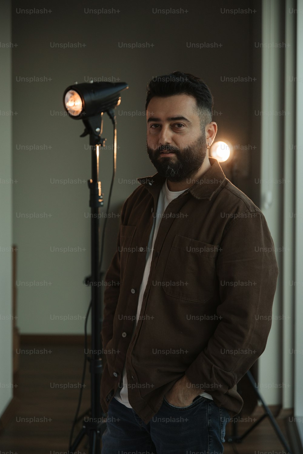 a man is standing in front of a light