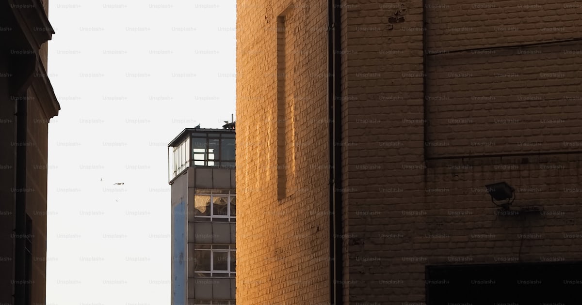 A view of a building from a distance photo – City wall Image on Unsplash