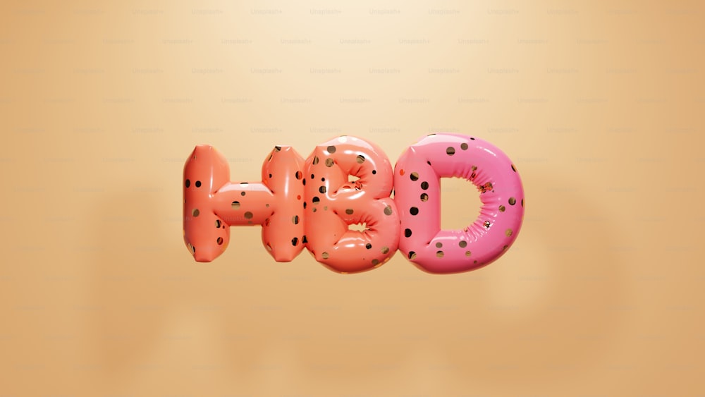 a pink and pink donut with black dots on it