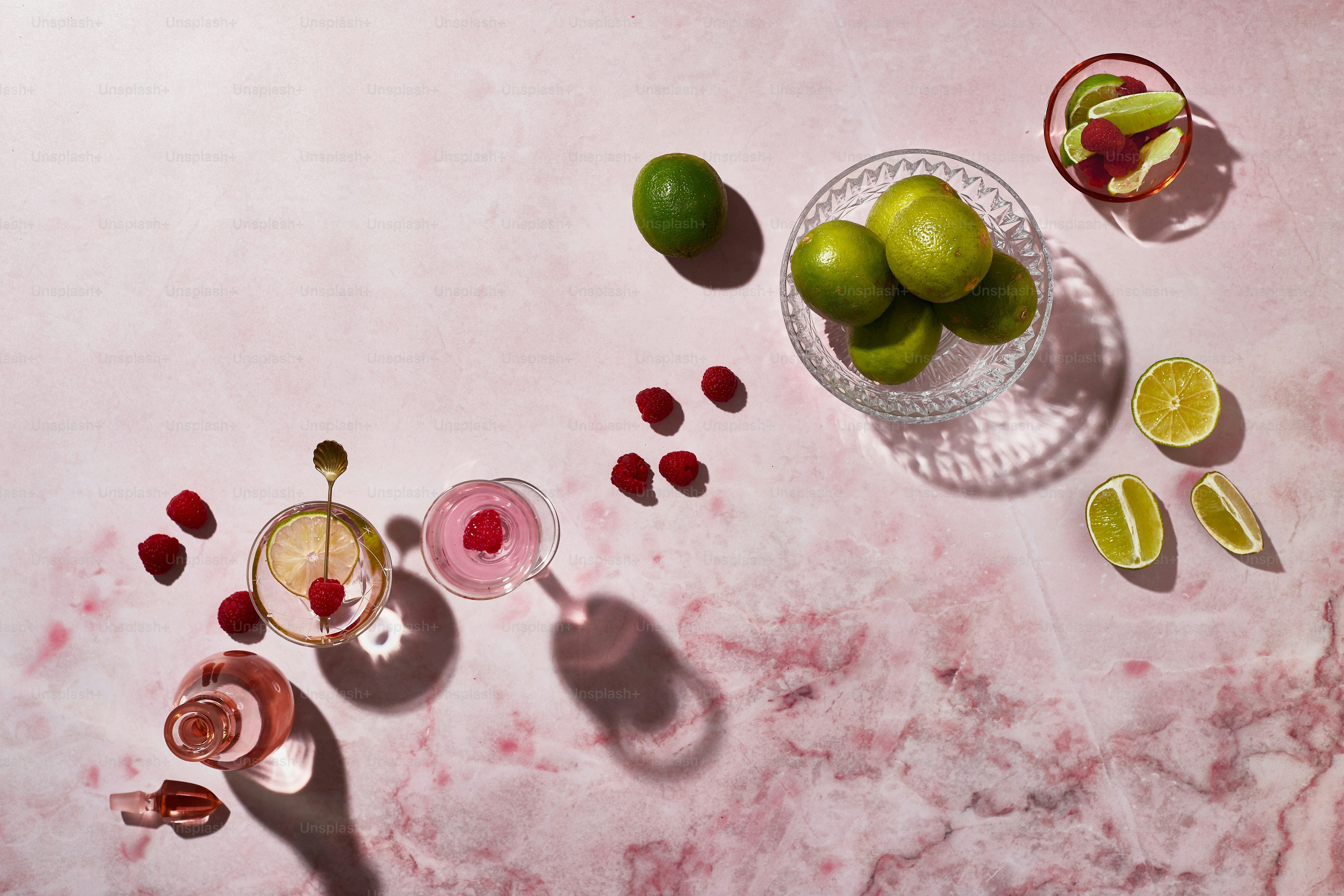 a table topped with glasses filled with different types of drinks