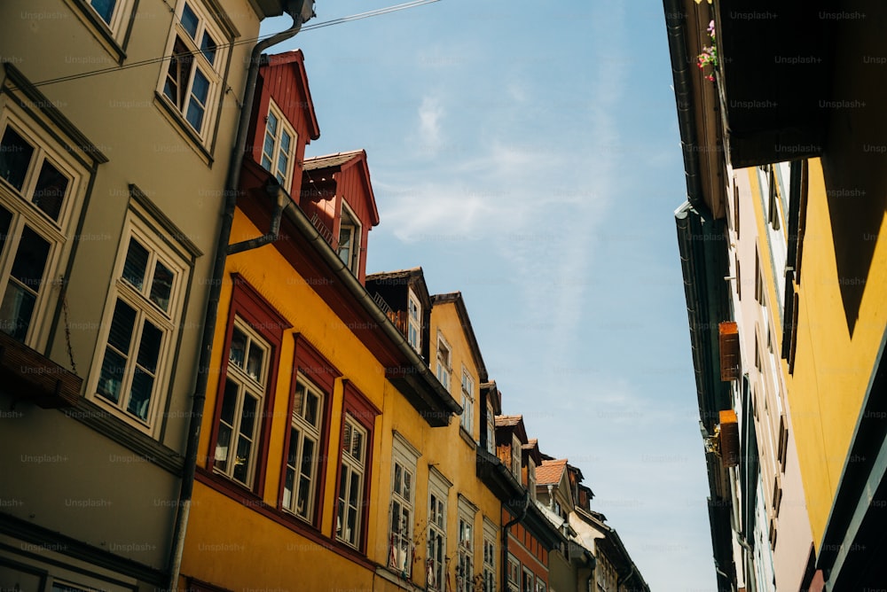 a row of multicolored buildings next to each other