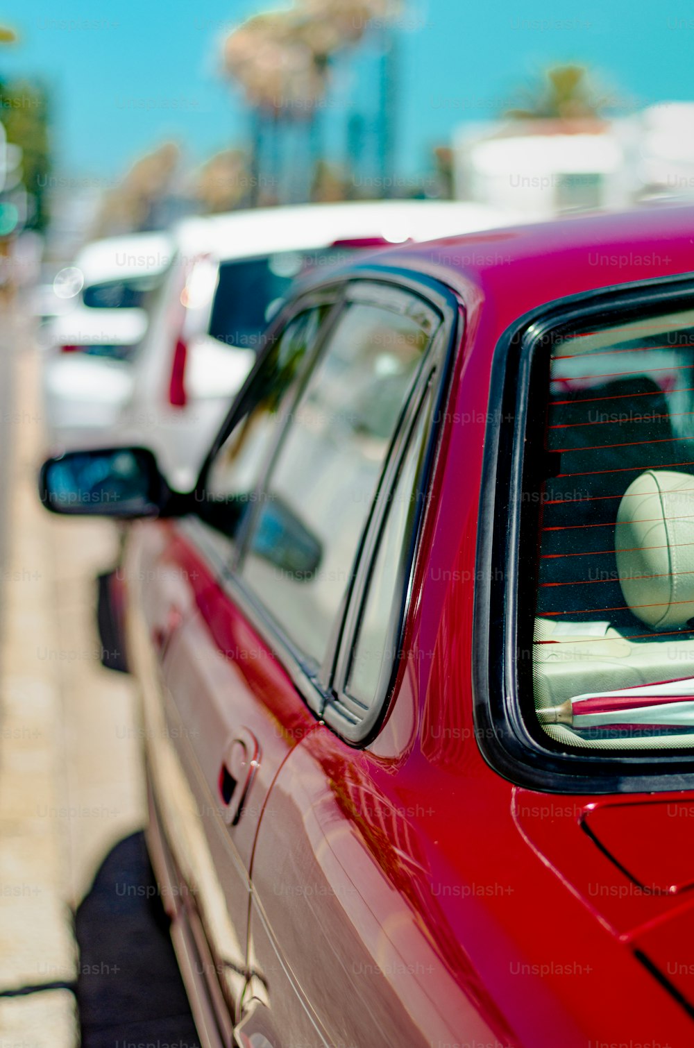 a red car parked on the side of the road