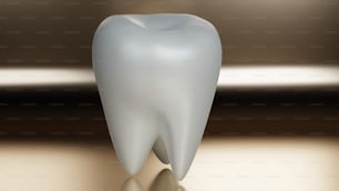 Un diente blanco sentado encima de una mesa
