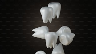 a group of white teeth on a black background