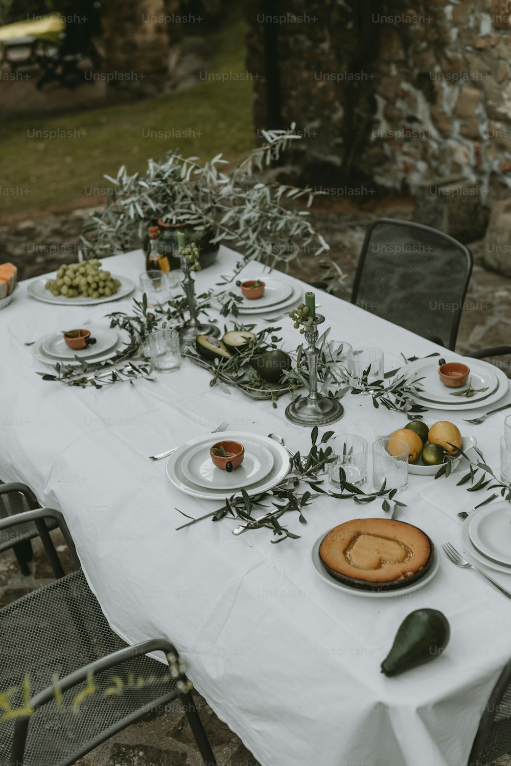 a table set up with plates and silverware