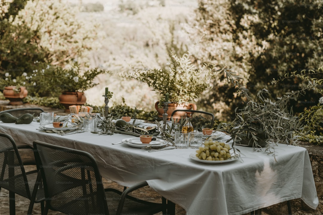 a table with plates of food and glasses on it