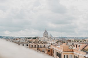 a view of a city with a dome in the background