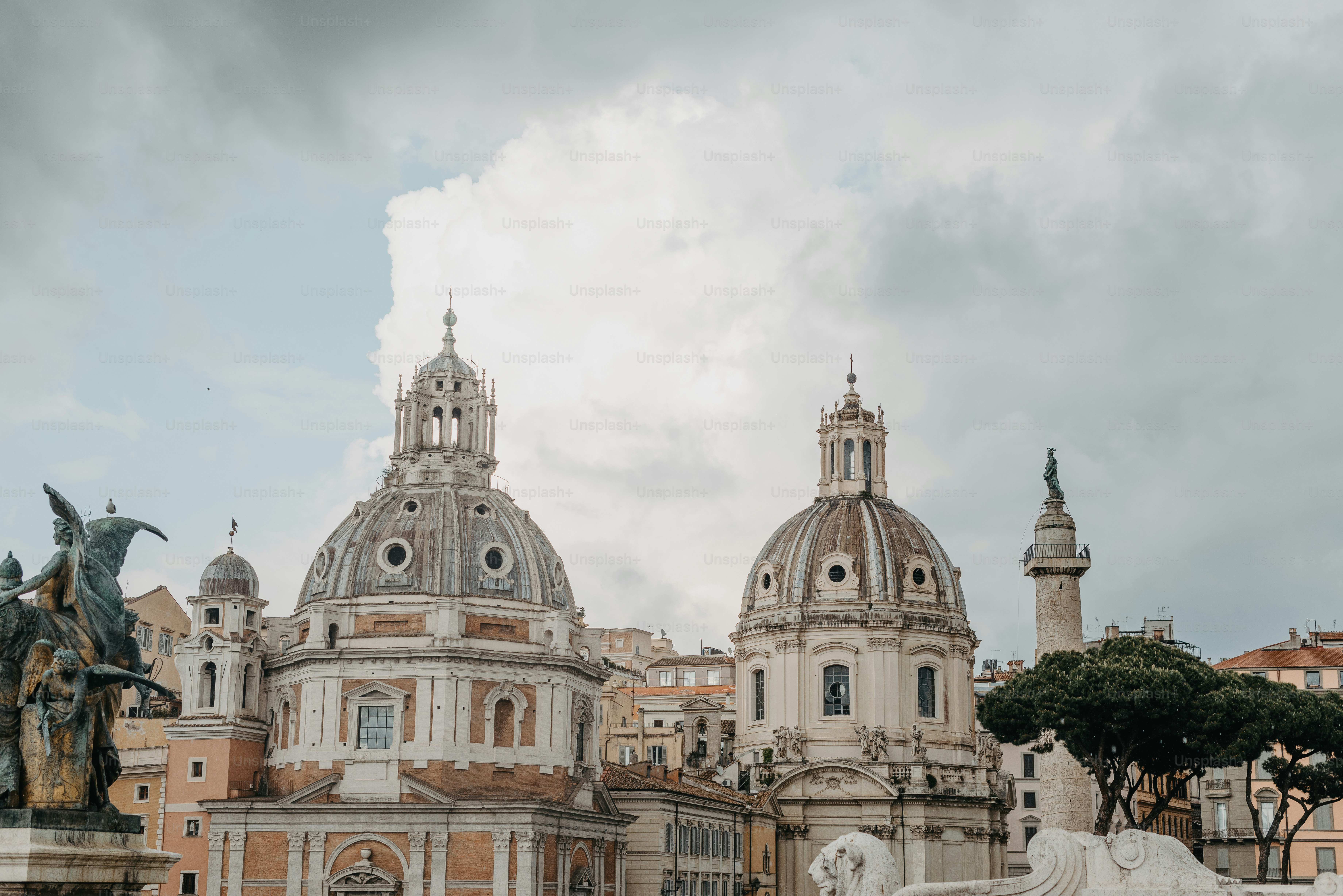 a large building with a statue in front of it