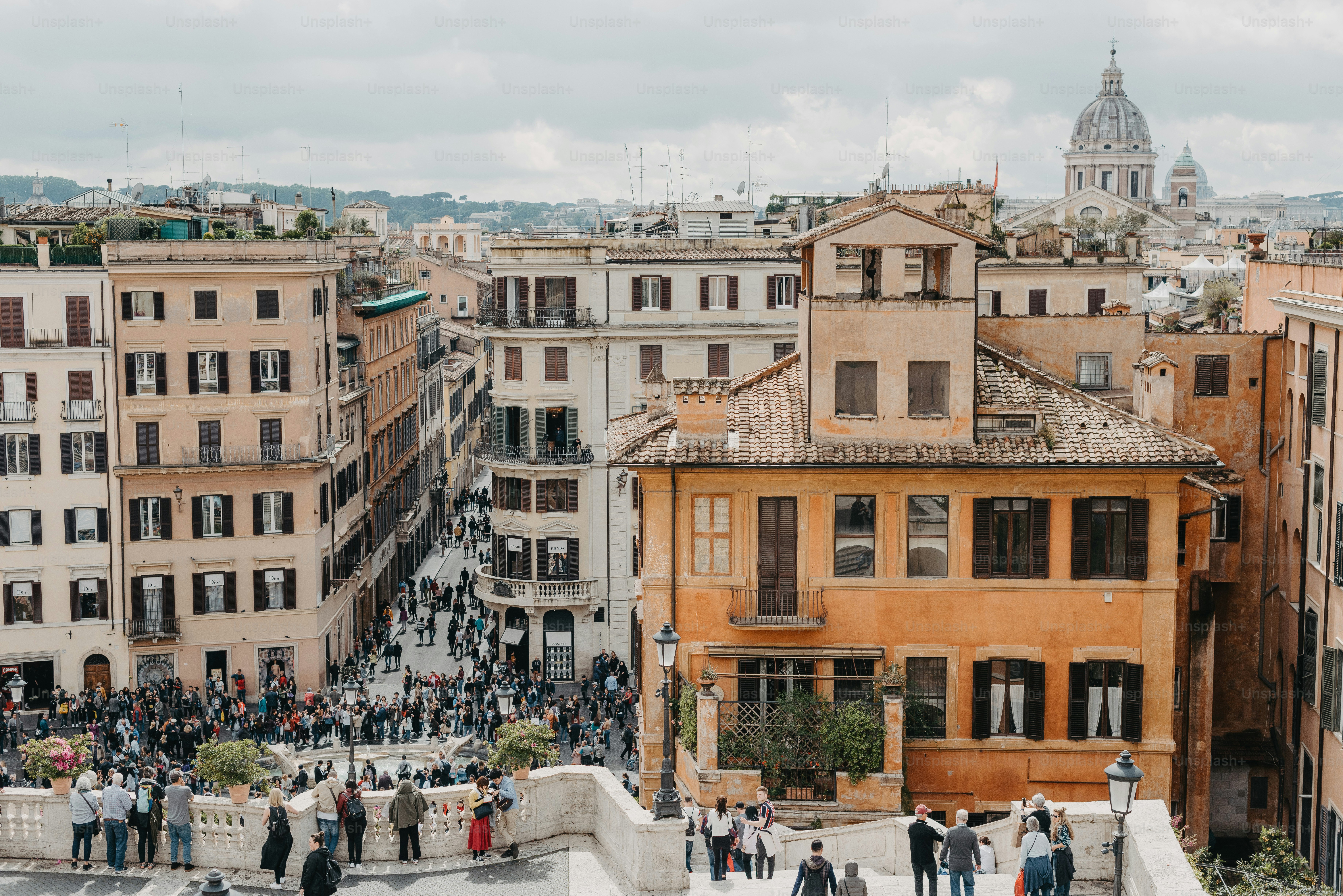 a group of people standing on top of a building