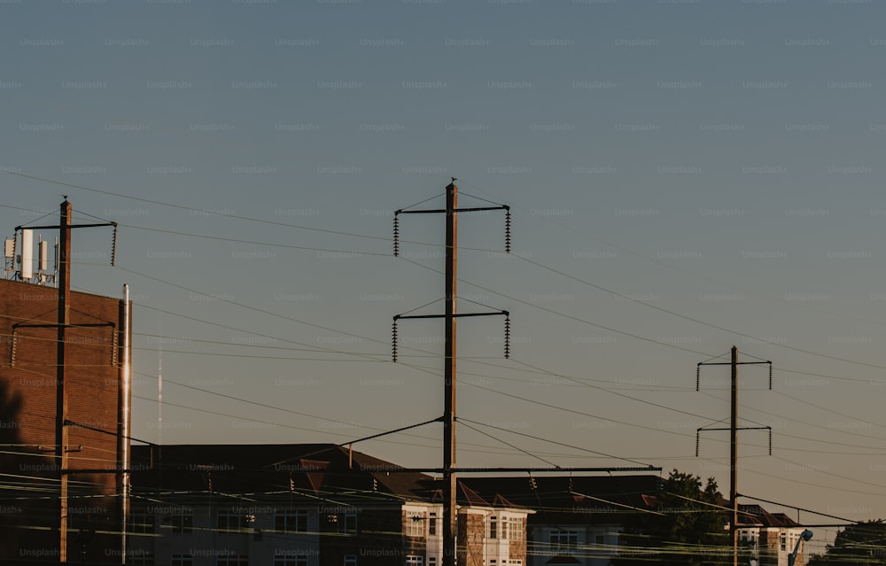 a row of telephone poles in front of a building