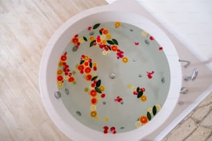 a bathtub filled with lots of different colored buttons
