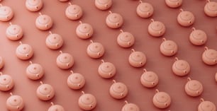 a group of small pink objects on a pink surface