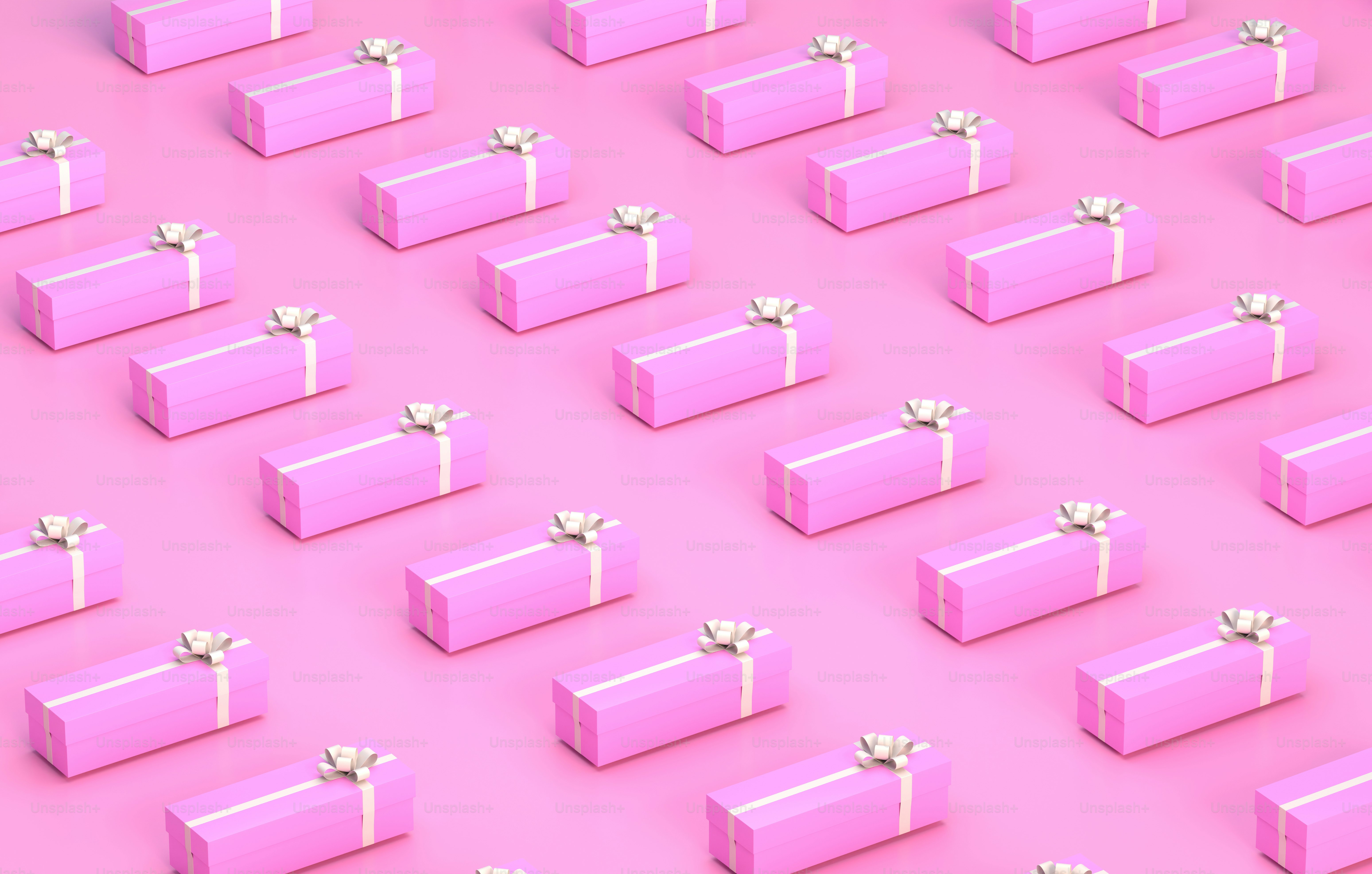 A group of pink boxes with bows on them photo – Wallpaper Image on Unsplash