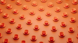 a group of orange cups sitting on top of a table