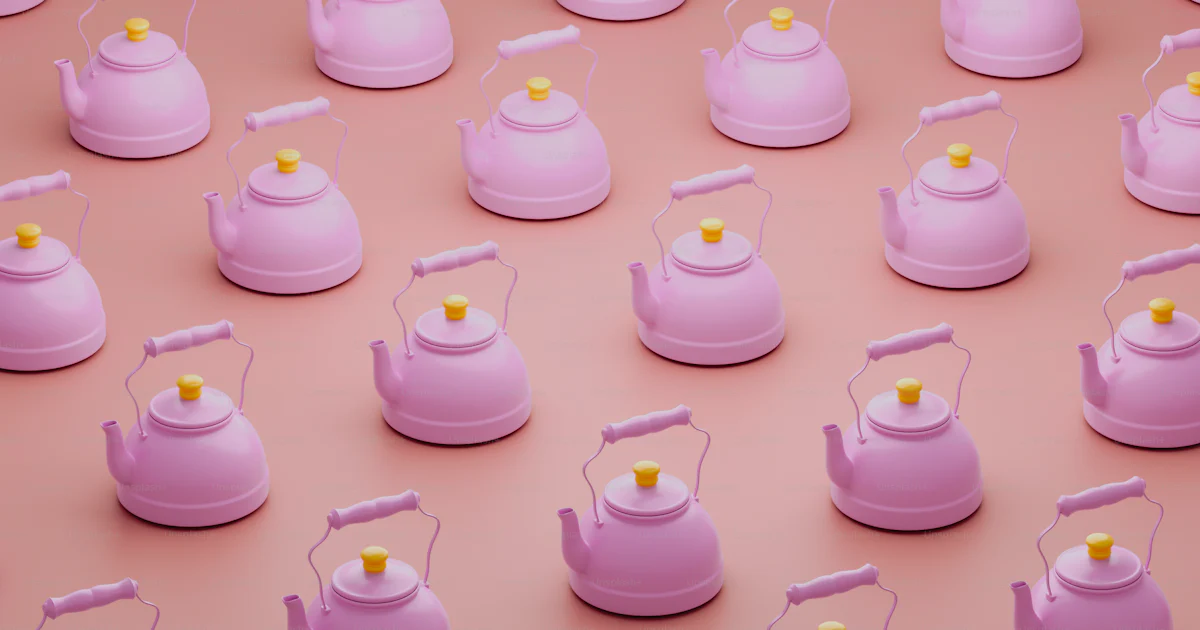 Pink Spring Tea Kettle A group of pink tea kettles sitting on top of a pink surface photo ...