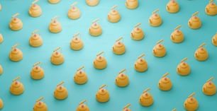 a group of yellow teapots with toothpicks sticking out of them