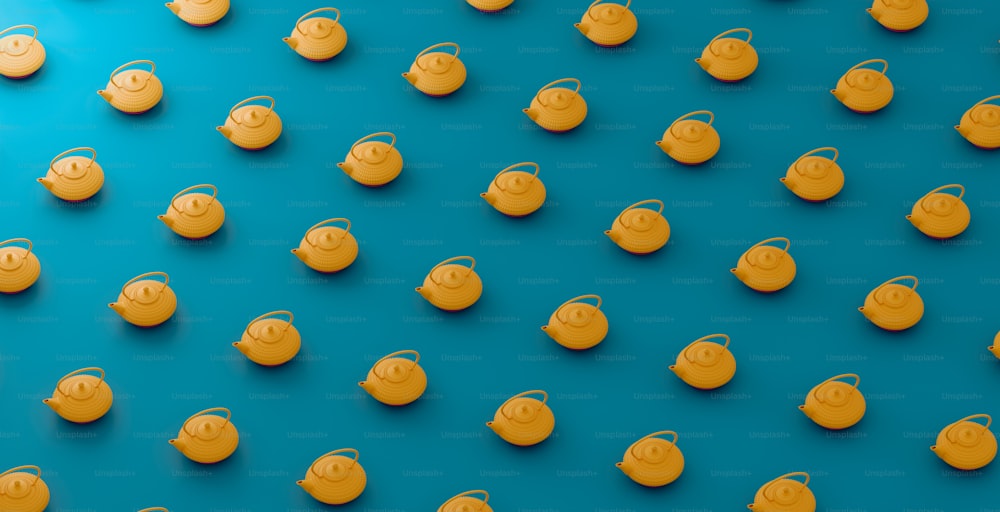 a group of small yellow objects sitting on top of a blue surface