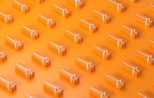 a group of orange boxes with bows on them