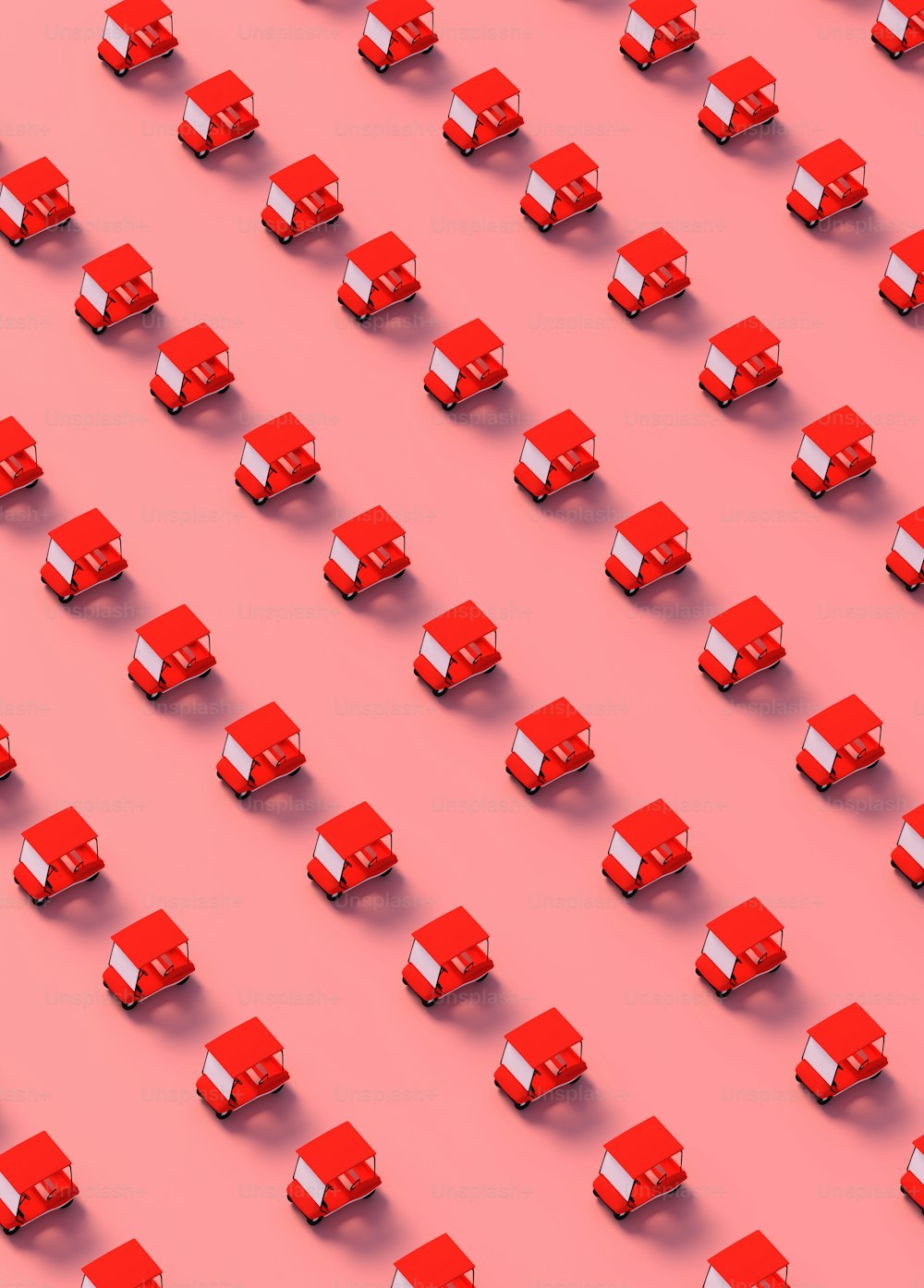eine große Gruppe roter Würfel auf rosa Hintergrund