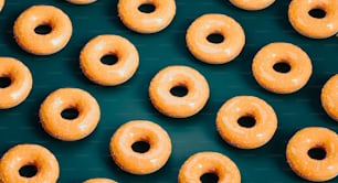 a group of glazed donuts sitting next to each other