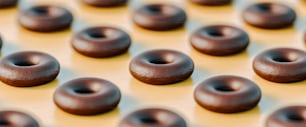 a close up of chocolate donuts on a table