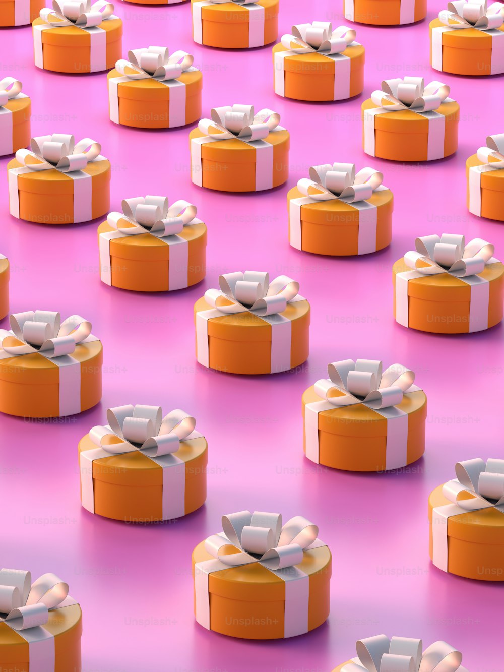 a group of orange and white boxes with bows