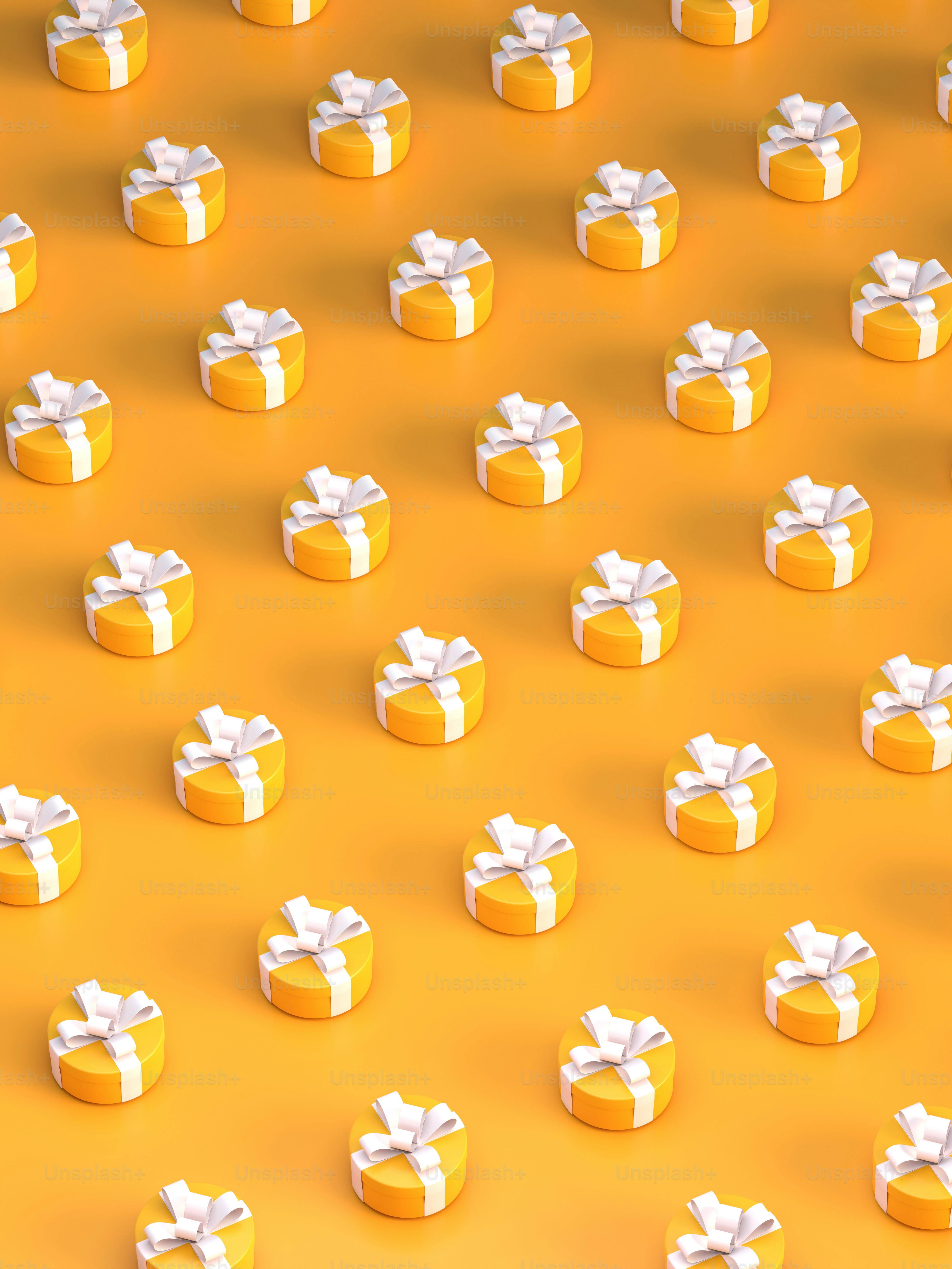 A group of yellow boxes with white bows photo – Laptop wallpaper Image
