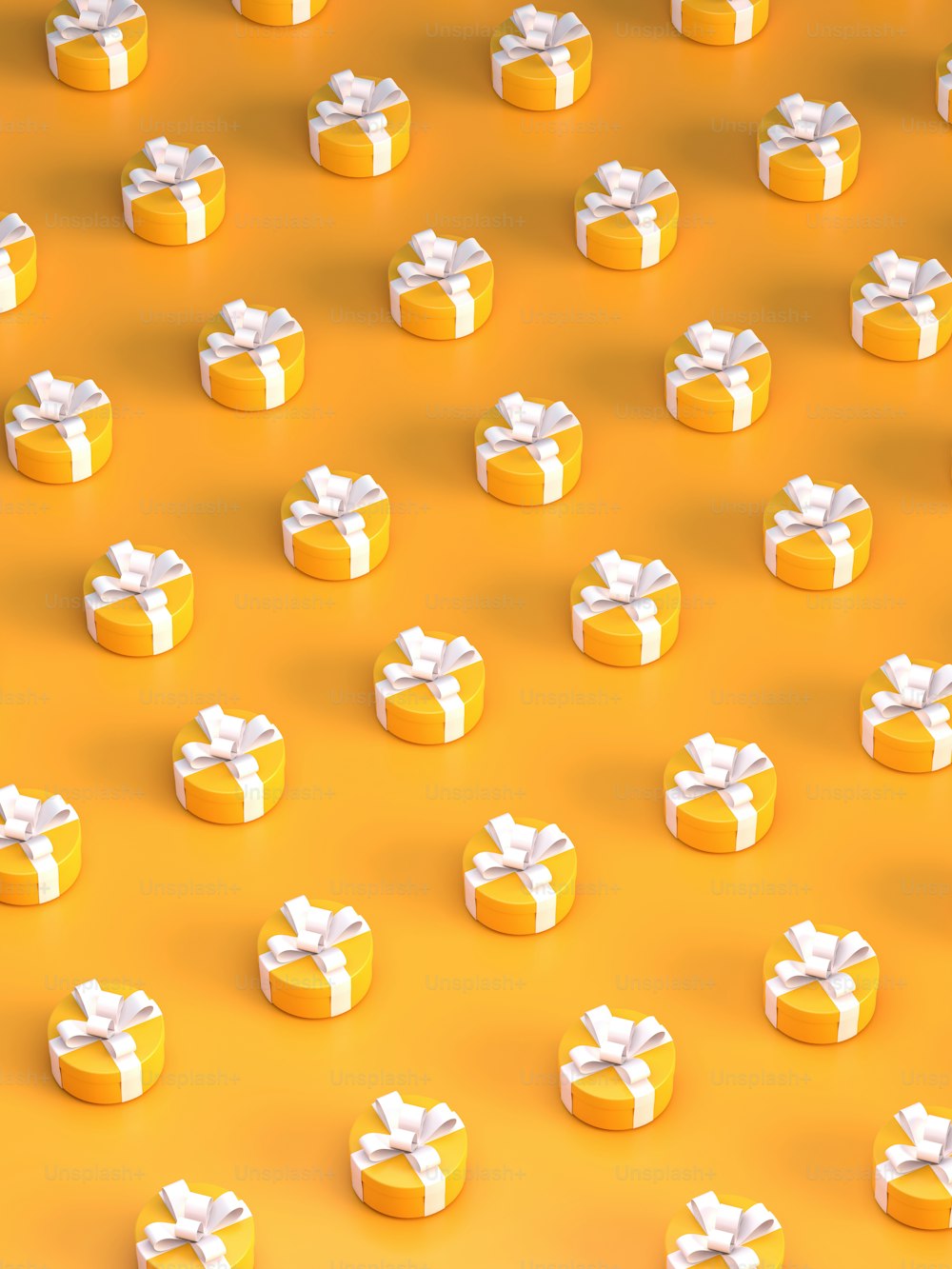 a group of yellow boxes with white bows