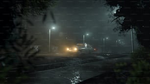 a truck driving down a rain soaked road at night