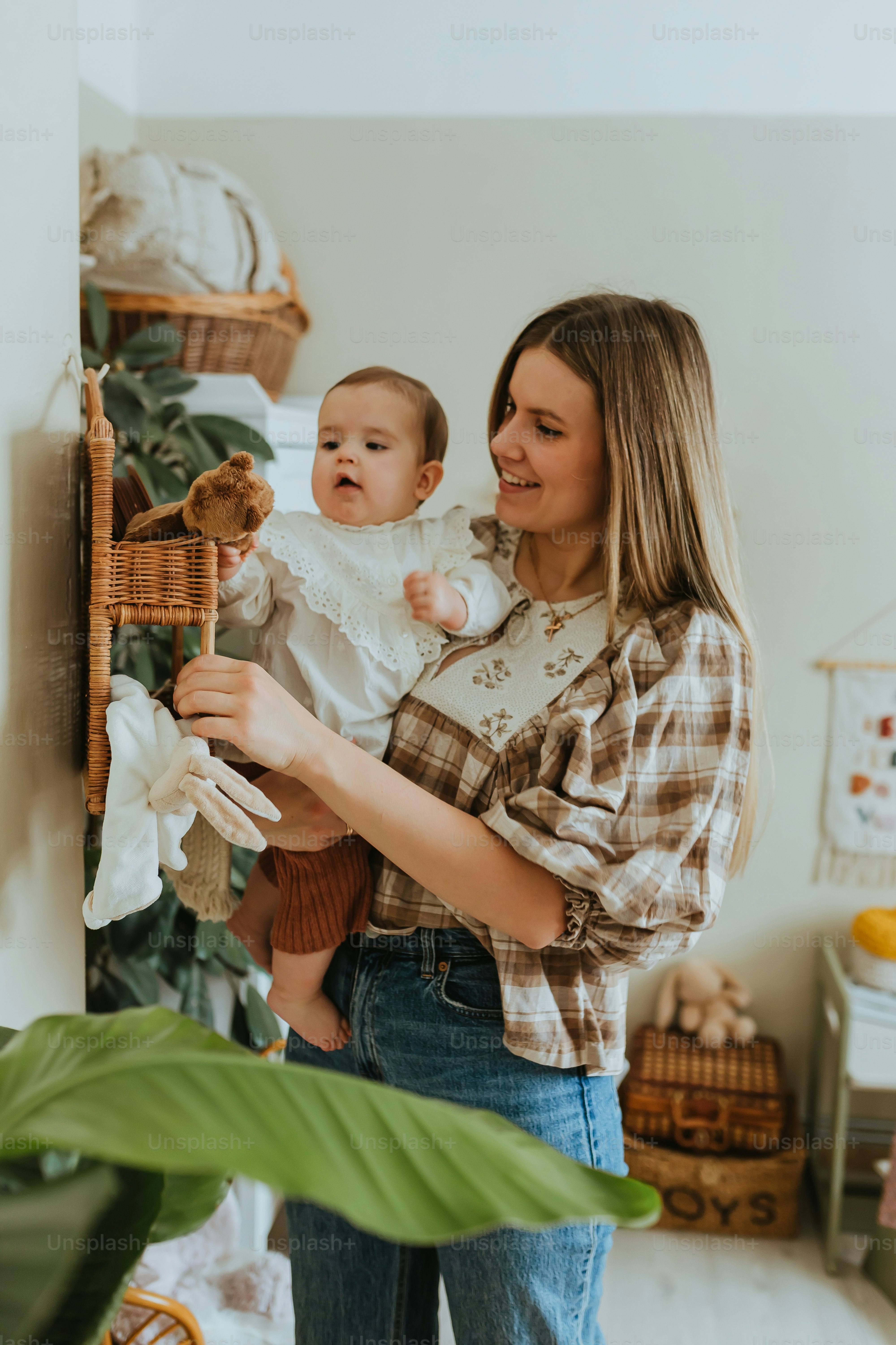 a woman holding a baby in her arms
