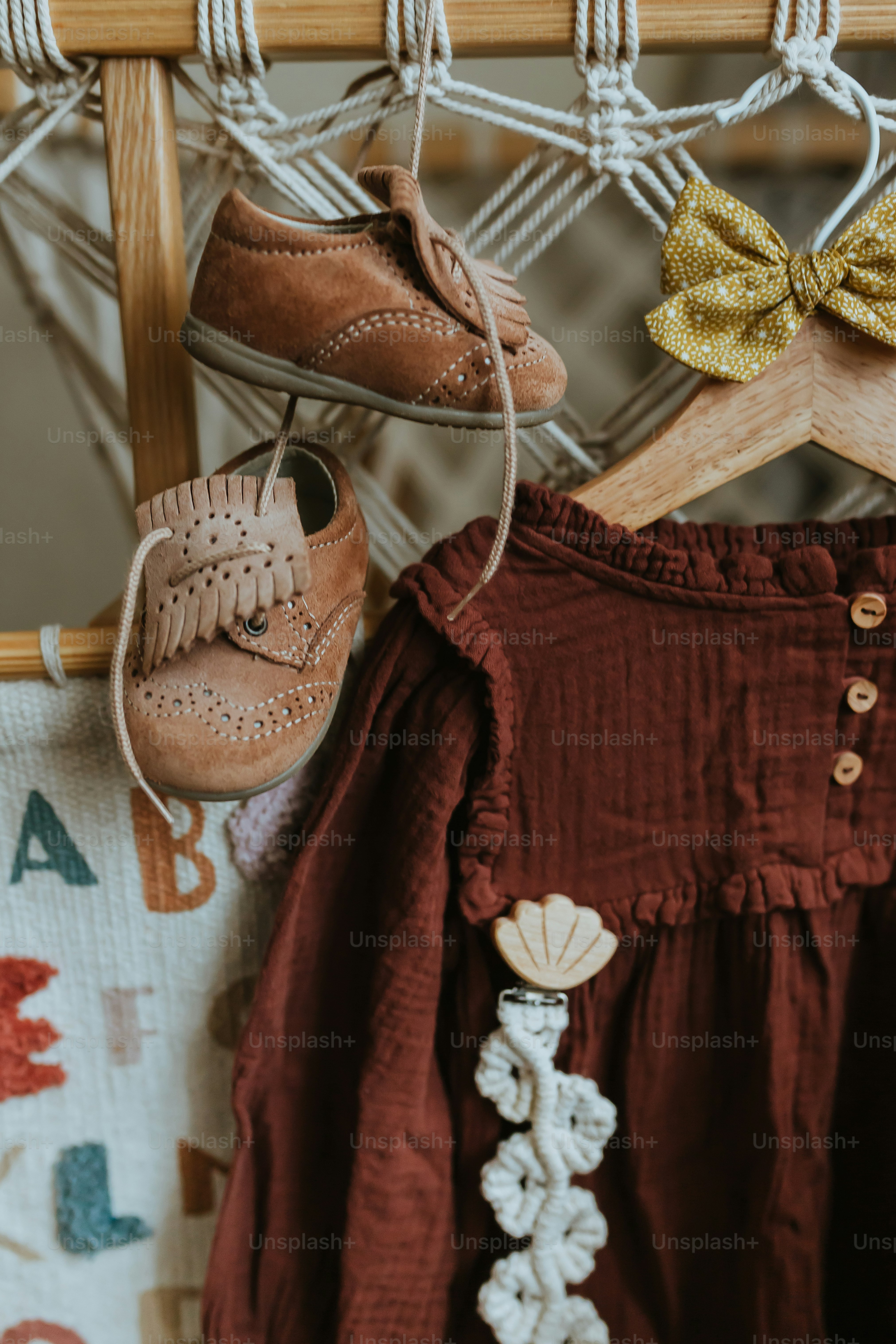 a pair of shoes hanging on a clothes rack