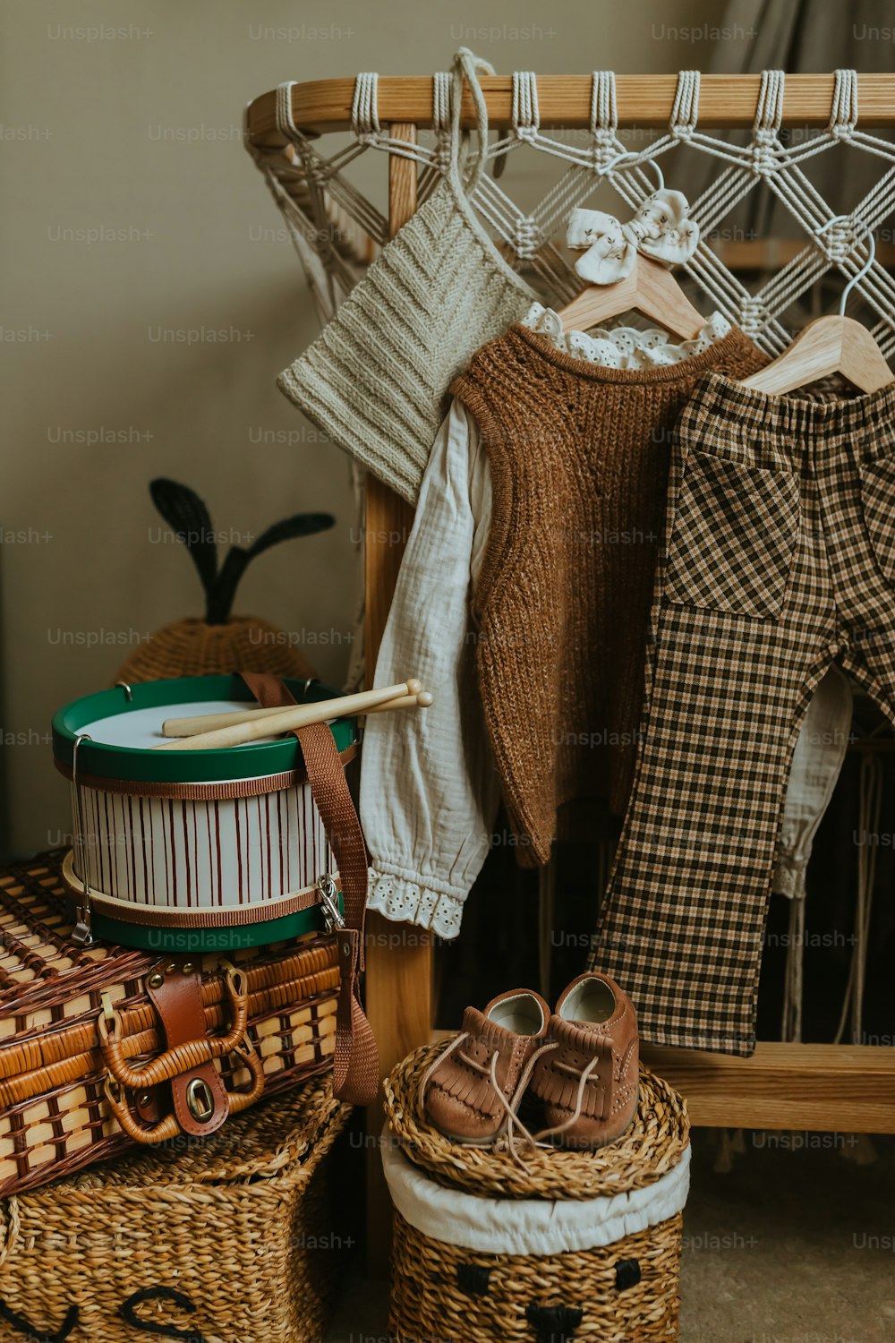 a pile of clothes sitting on top of a wooden chair