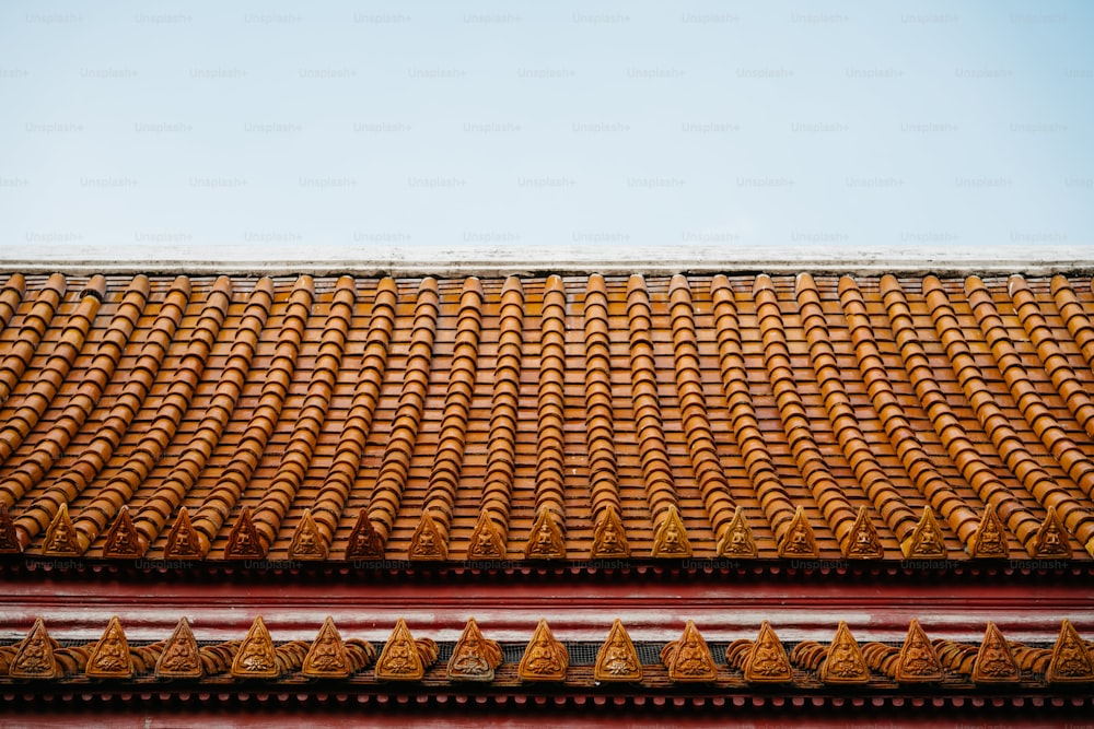 a close up of a roof with a sky background