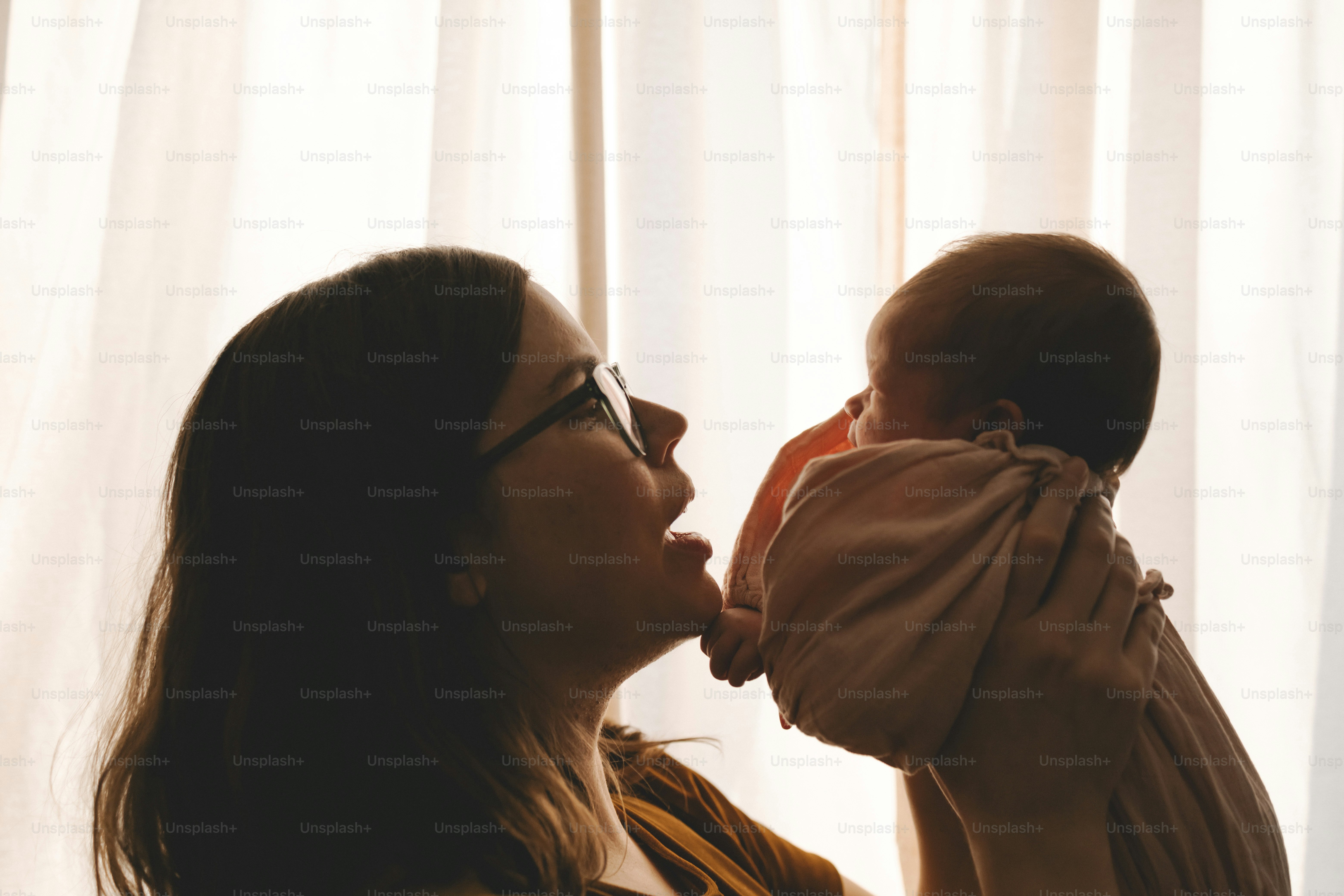 a woman holding a baby in her arms