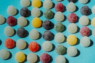 a group of candies sitting on top of a blue surface