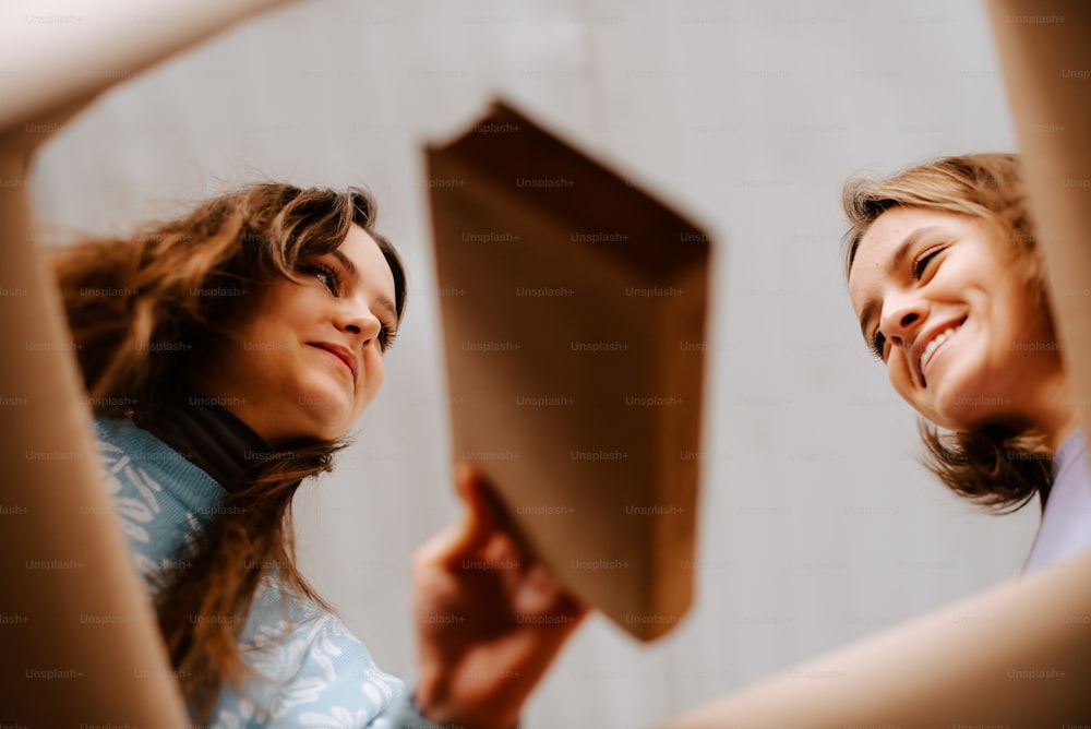 a couple of women standing next to each other