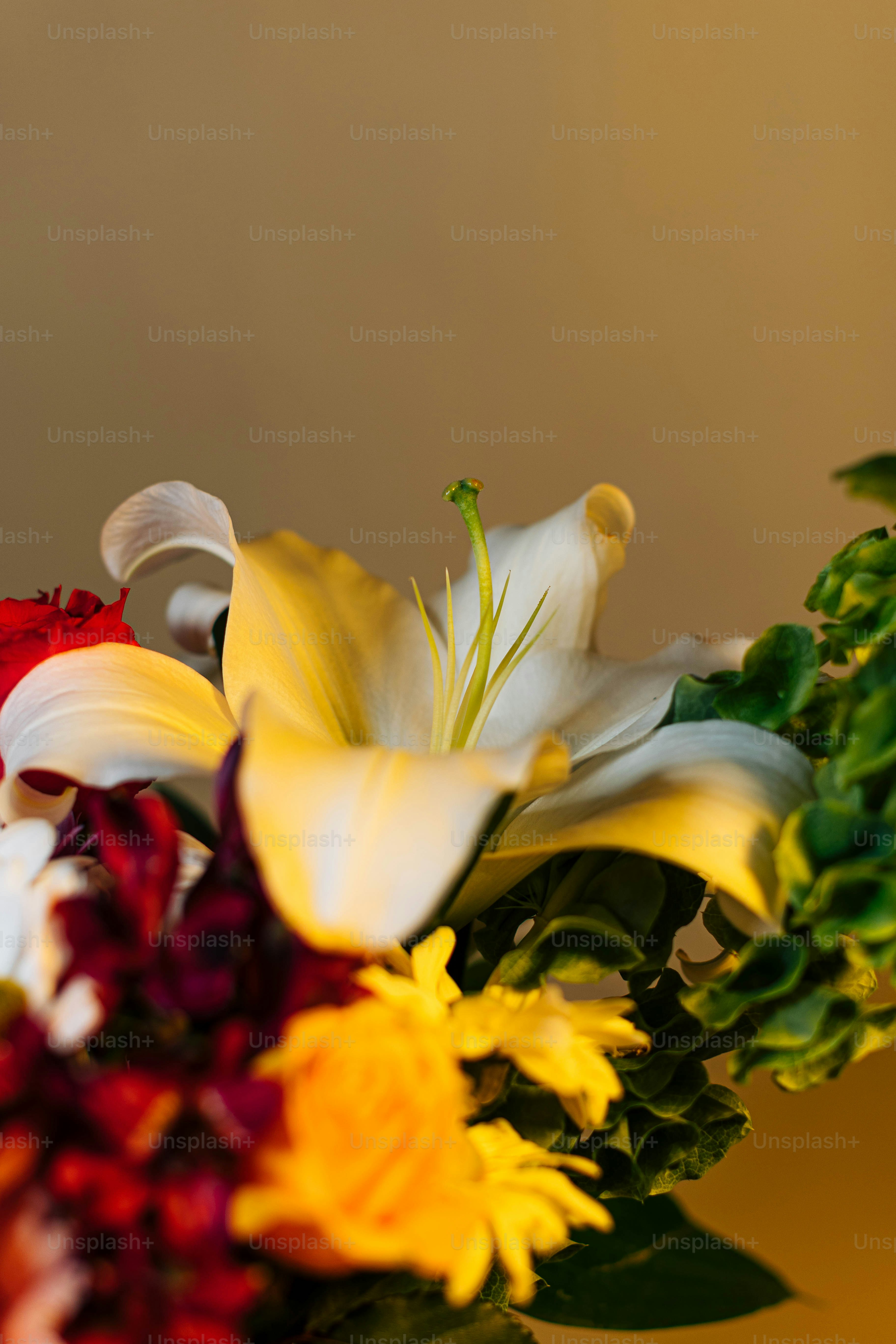 a bouquet of flowers in a vase on a table