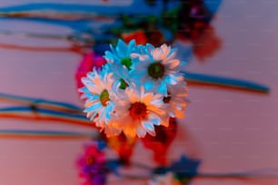 a bunch of flowers that are sitting in a vase