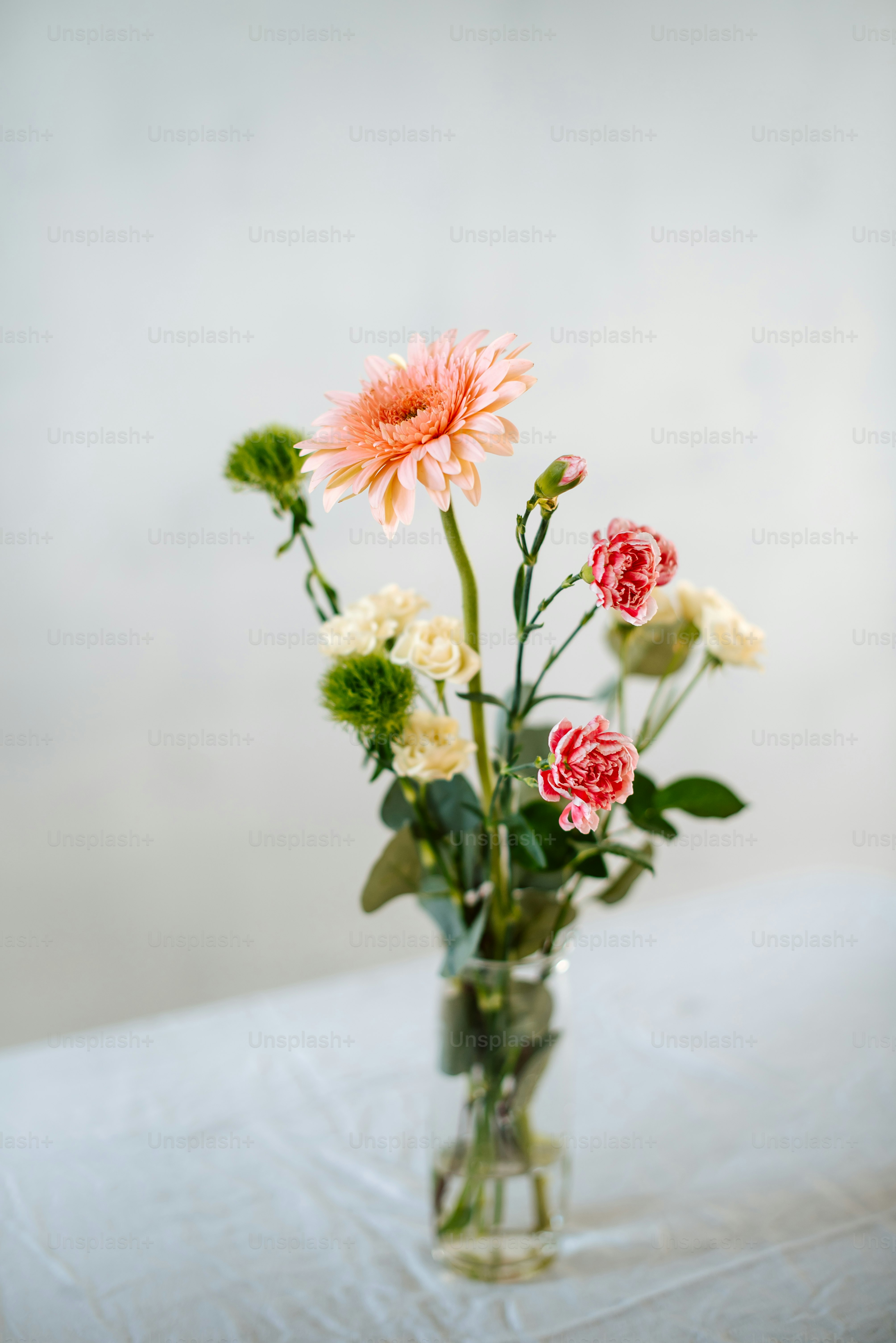 a vase filled with flowers on top of a table