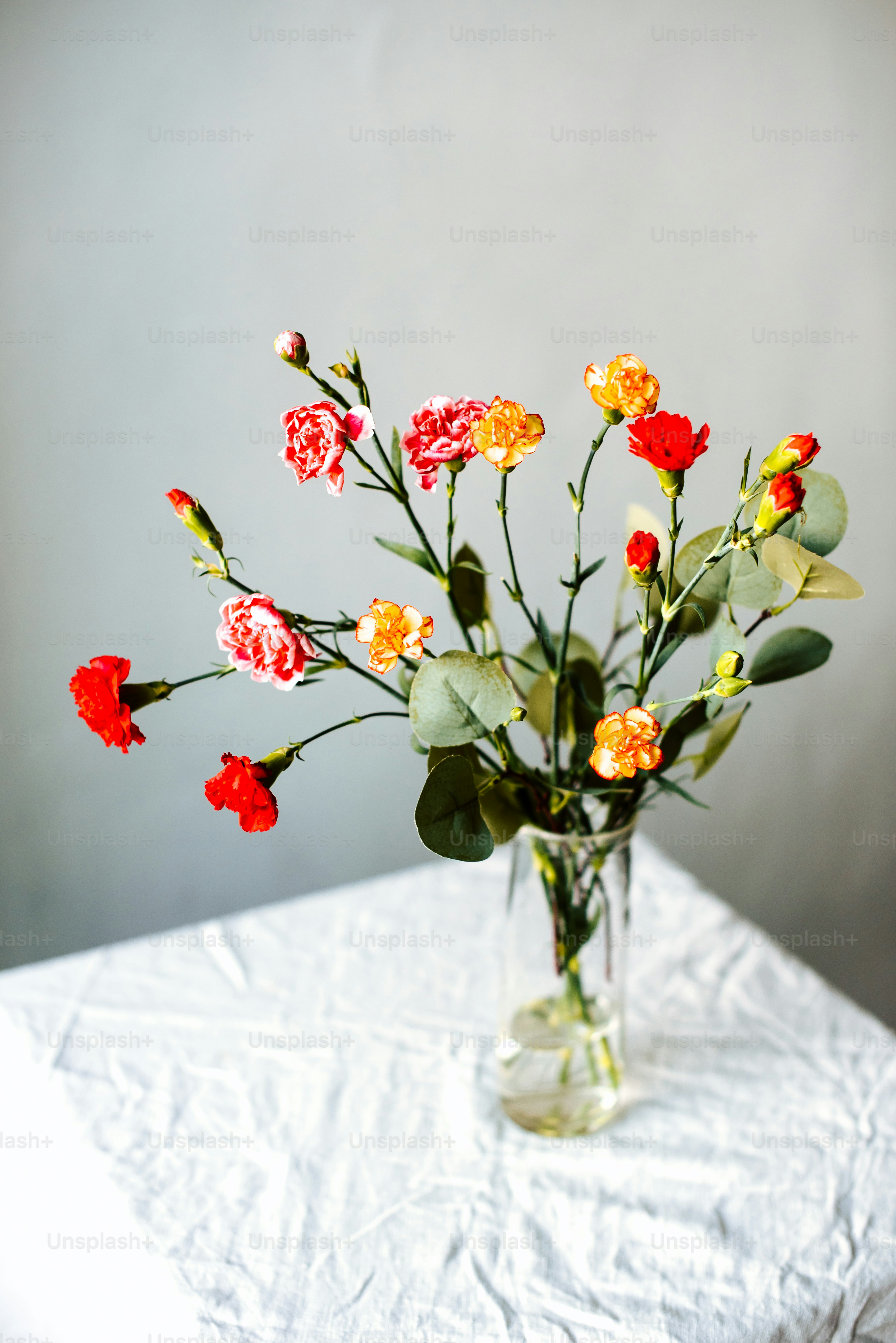 a vase filled with flowers on top of a table