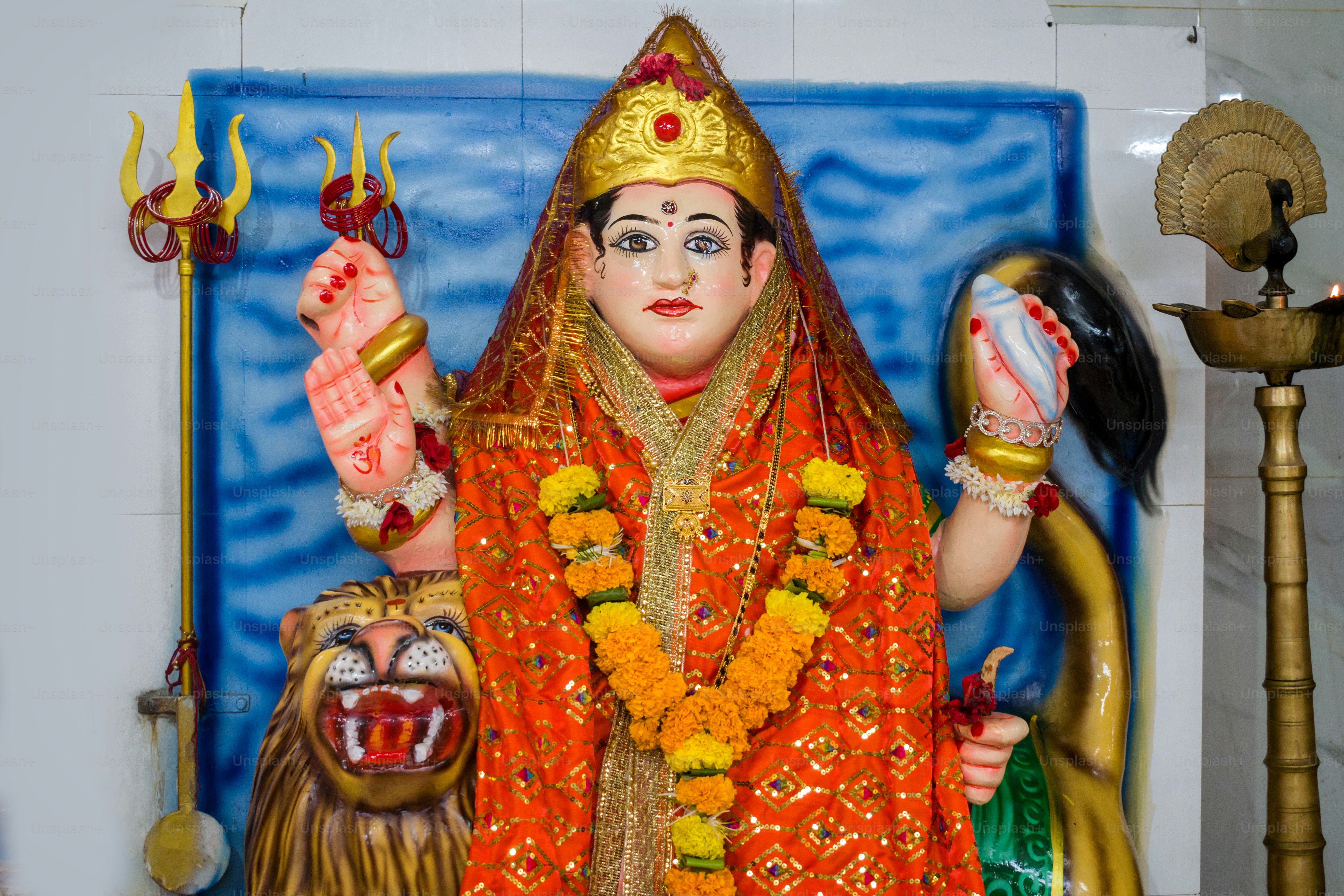 A beautiful idol of Maa Durga being worshipped at a Hindu temple in Mumbai, India for the festival of Navratri or Durga Puja