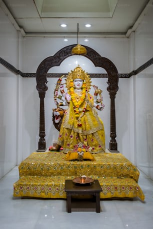 a statue of a hindu god in a room