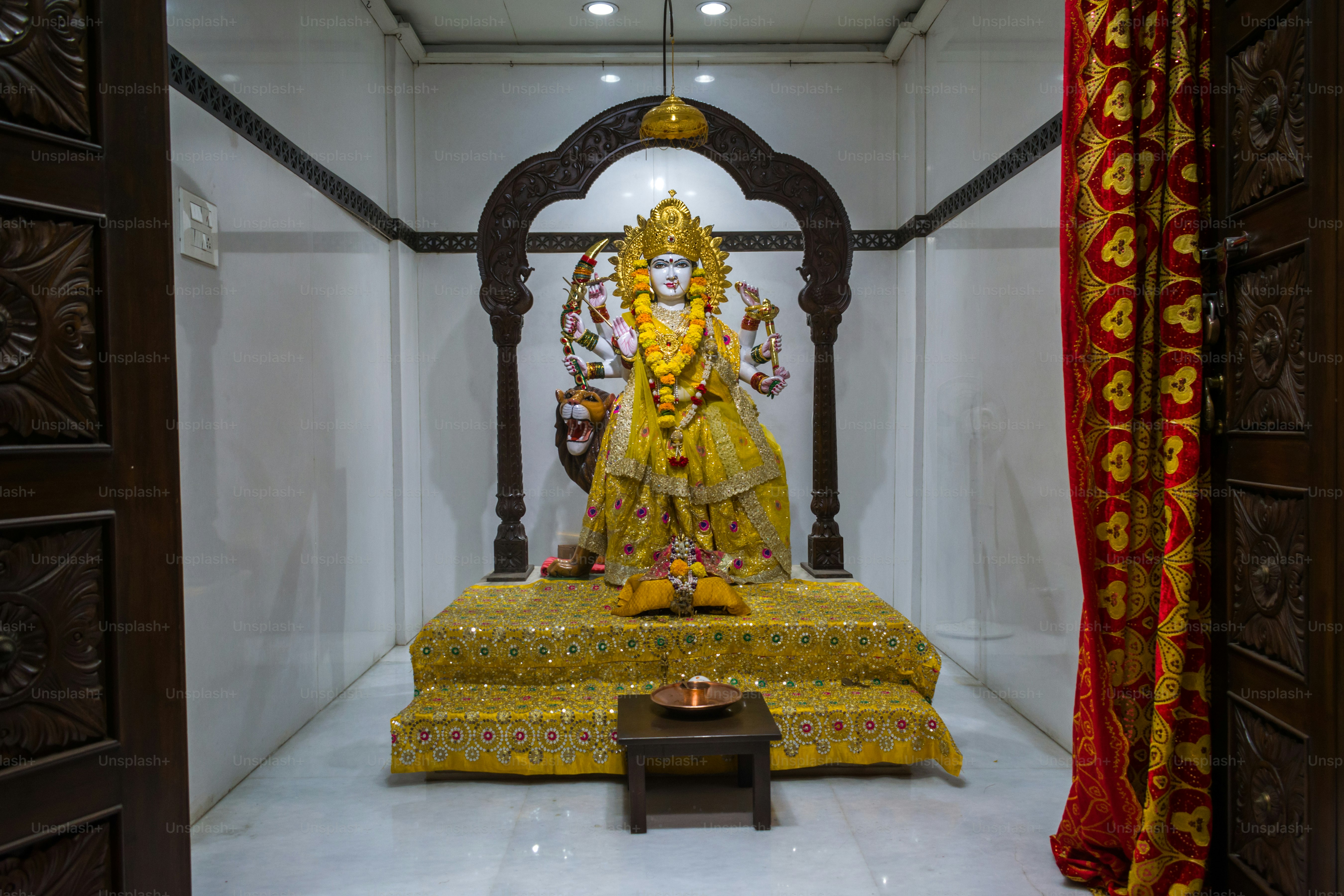 A beautiful idol of Maa Durga being worshipped at a Hindu temple in Mumbai, India for the festival of Navratri or Durga Puja