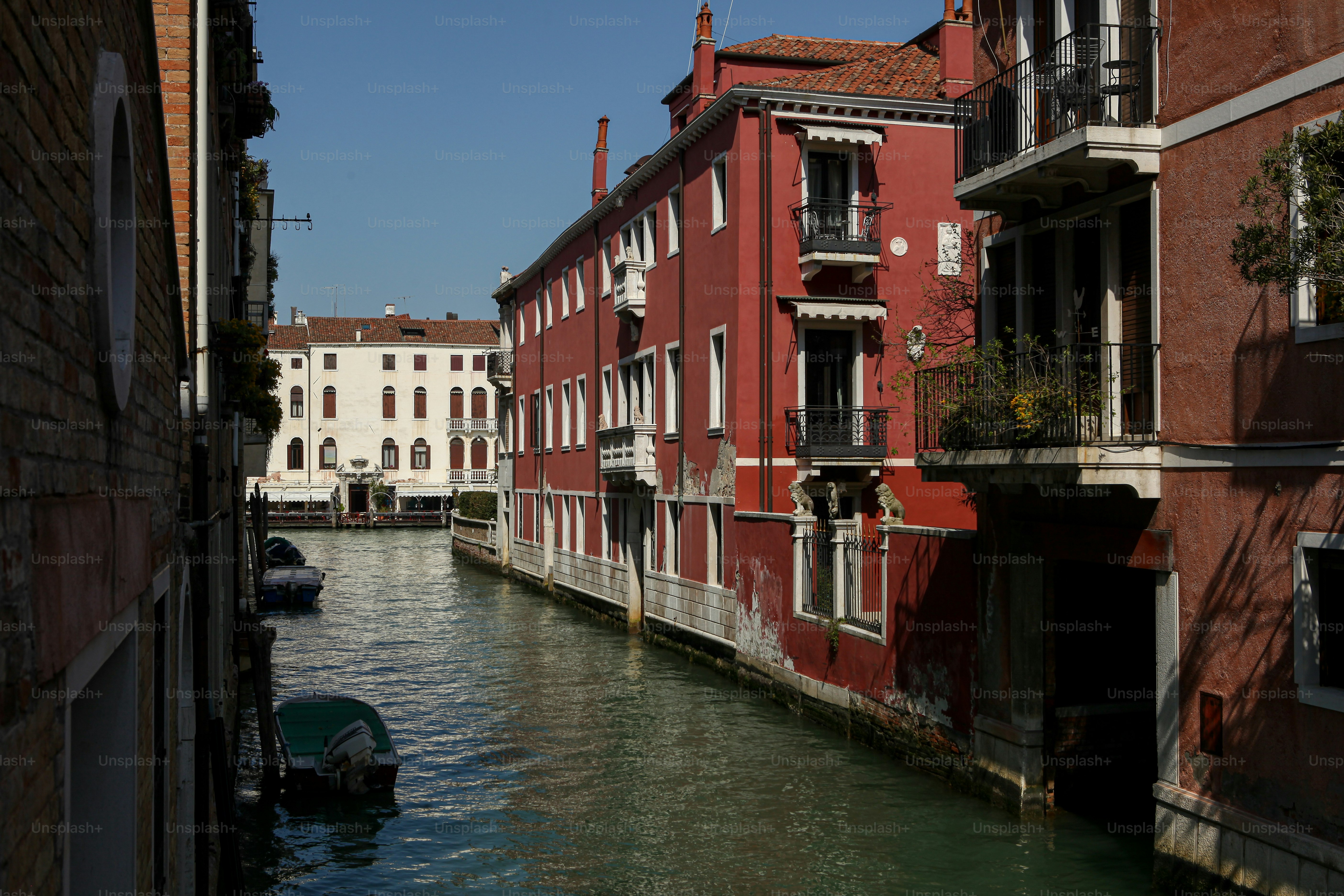 a narrow canal with buildings on both sides