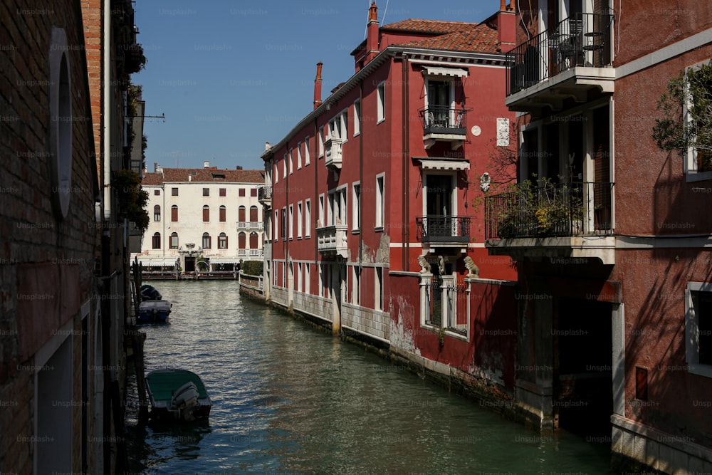 a narrow canal with buildings on both sides